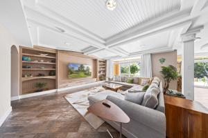 a living room with a couch and a table at Divi Village Condo 33 J.E. Irausquin Blvd 93 in Palm-Eagle Beach