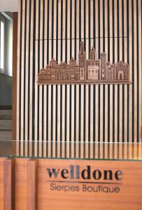 a display case with a building on a wall at Welldone Sierpes Boutique in Seville