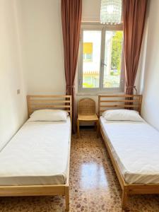 Кровать или кровати в номере Green House Nonna Angela