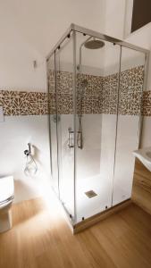 a glass shower stall in a bathroom with a sink at Casa Vacanze Ramo in Mazara del Vallo