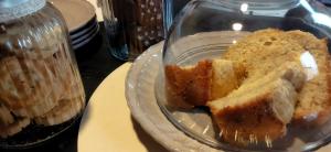 a glass plate with a piece of cake on a table at Gli Oleandri Rooms Casa Teresa in Conselice