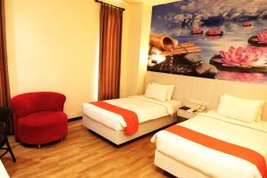 Uma cama ou camas num quarto em Halogen Hotel Airport Surabaya