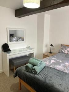 Ένα ή περισσότερα κρεβάτια σε δωμάτιο στο The Byre