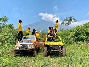 a group of people standing on the back of a truck at Metland Hotel Cirebon by Horison in Cirebon