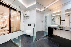 two pictures of a bathroom with a shower and a toilet at FabHotel Mandiram Palace in Udaipur