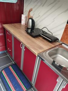 a table with a phone on it next to a sink at apartman Dragic in Budva
