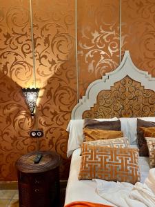 A bed or beds in a room at Posada la Leyenda