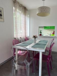 a dining room with a table and chairs at Apartment Ljubljana - Free parking in Ljubljana +22 photos