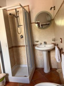 a bathroom with a shower and a sink at Country House B&B Antica Dimora Del Sole in Camerota