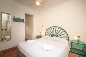 A bed or beds in a room at Villa Ari