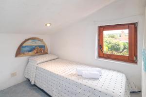 A bed or beds in a room at Villa Ari