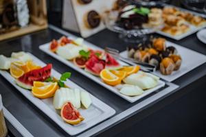a table with three plates of food on display at Prawdzic Family Resort & Wellness in Gdańsk