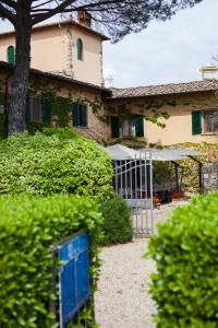 a house with a gate in front of it at Viticcio in Greve in Chianti