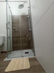 a shower with a glass door in a bathroom at Casa Laura y Pancho in Fasnia +32 photos