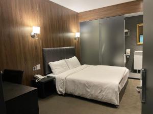 Postel nebo postele na pokoji v ubytování Meworld Hotel - Taipei Main Station