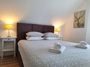 Posteľ alebo postele v izbe v ubytovaní Apartments Poljanak