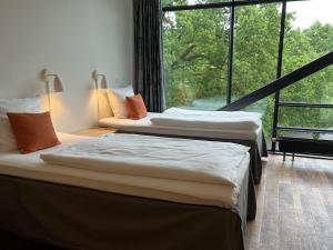 Postel nebo postele na pokoji v ubytování Vingsted Hotel & Konferencecenter