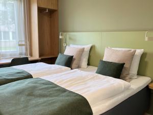 Postel nebo postele na pokoji v ubytování Vingsted Hotel & Konferencecenter