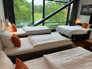 Postel nebo postele na pokoji v ubytování Vingsted Hotel & Konferencecenter