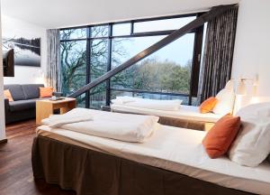 Postel nebo postele na pokoji v ubytování Vingsted Hotel & Konferencecenter