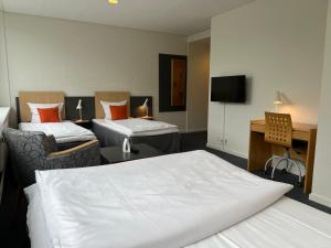 Postel nebo postele na pokoji v ubytování Vingsted Hotel & Konferencecenter