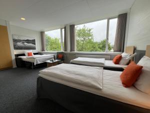 Postel nebo postele na pokoji v ubytování Vingsted Hotel & Konferencecenter