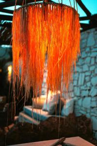 a bunch of hay hanging from a ceiling at Sea Side Studios & Houses in Kalo Livadi