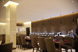 a large dining room with a long table and chairs at Bolton White Hotel - Abuja in Wuse