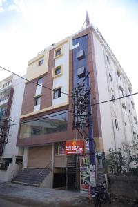 a building with a sign in front of it at virat inn in Bangalore