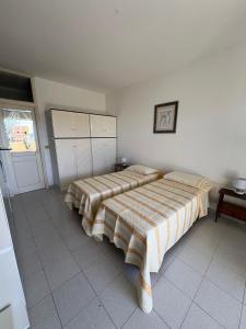 Postel nebo postele na pokoji v ubytování Casa Ermelinda