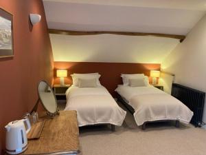 Postel nebo postele na pokoji v ubytování Chambres & Table d'hôtes de La Vieille Ferme