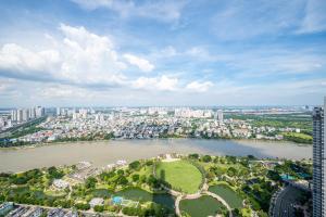 an aerial view of a city with a lake at LANDMARK 81 Condotel Garden Bay in Ho Chi Minh City +89 photos
