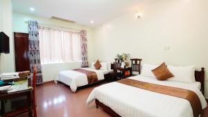 Cama o camas de una habitación en Ho Sen Xanh Hotel