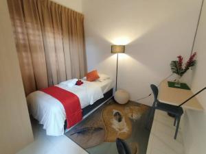 Postel nebo postele na pokoji v ubytování Tulip Homestay