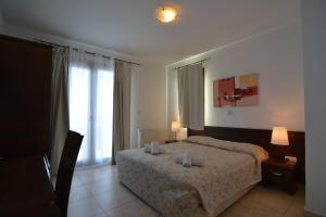 Postel nebo postele na pokoji v ubytování Palates Hotel