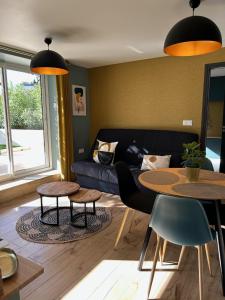 Posedenie v ubytovaní Appartement Proche Hôpital, Jardin privatif