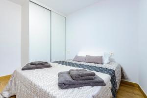 Ένα ή περισσότερα κρεβάτια σε δωμάτιο στο Un endroit accueillant avec vue à Jerica