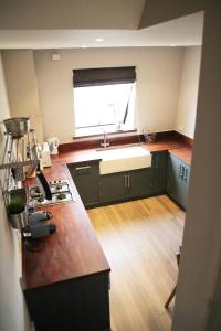 a kitchen with a sink and a counter top at GuestReady - Quaint English Flat near Portobello in London