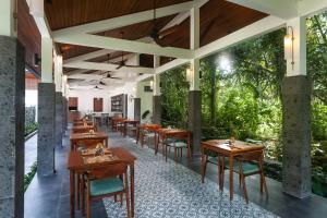 En restaurant eller et spisested på The Ambengan Villas Ubud by Pramana Villas