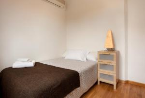 Katil atau katil-katil dalam bilik di GuestReady - Charming simplicity near Casa Milà