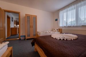 Postel nebo postele na pokoji v ubytování Apartmány Dreams