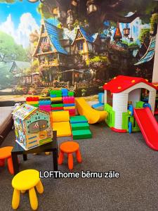 a play room with a bunch of different colored toys at LOFT Home in Daugavpils