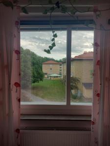 a window with a view of a yard at feel like your own home in Linköping