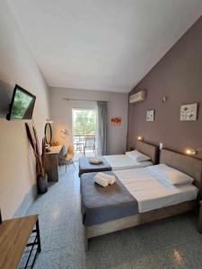 Postel nebo postele na pokoji v ubytování Ilias Apartments