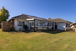 a house with a large yard in front of it at 24 Bergview Road apartment in Hilton