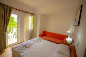 Postel nebo postele na pokoji v ubytování Celeste Hotel + 37 fotografií