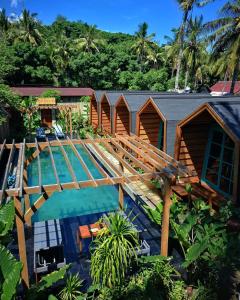 an overhead view of a resort with a swimming pool at Absolute Villa in Gili Trawangan