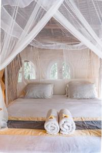Tempat tidur dalam kamar di La Santa Rosa