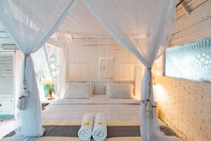 Tempat tidur dalam kamar di La Santa Rosa
