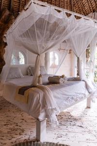 Tempat tidur dalam kamar di La Santa Rosa